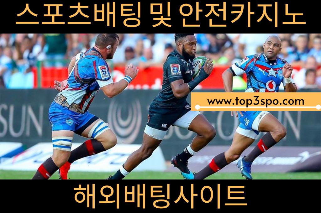 three rugby players trying their best to get the ball
